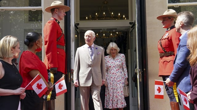 Britain's King Charles, centre left, and Queen Camilla leave after visiting the Canada House Trafalgar Square in London on Tuesday, May 20, 2025 to mark 100 years since it opened in June 1925. (Arthur Edwards/Pool via AP)