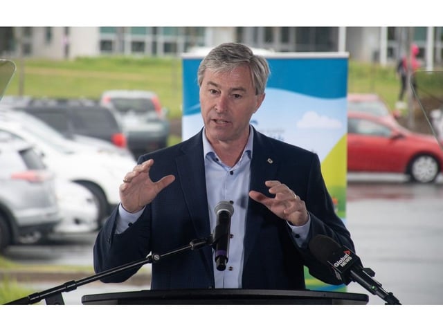 Premier Tim Houston answers questions from reporters about the shingles vaccine during a news conference at the Keshen Goodman Library in Halifax on Tuesday, May 20, 2025. The vaccine, which costs around $400, will now be free for Nova Scotia seniors aged 65 and older.