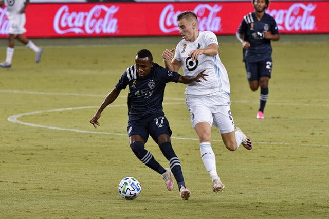 Gadi Kinda #17 of Sporting Kansas City controls the ball against Jan Gregus #8 of Minnesota United FC in the first half at Children&#39;s Mercy Park on September 13, 2020 in Kansas City, Kansas.