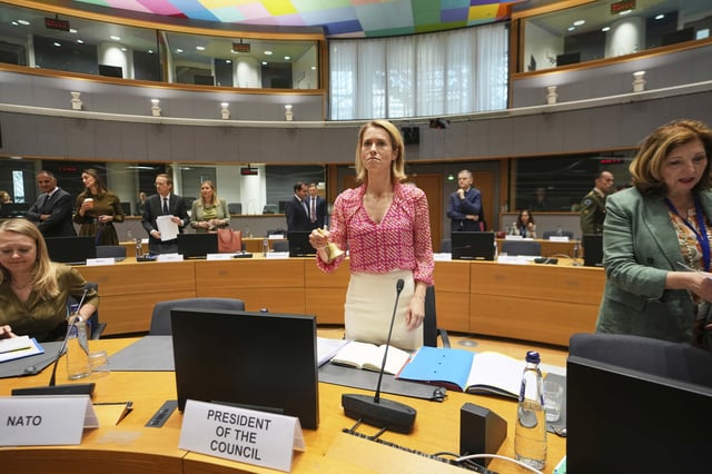 European Union foreign policy chief Kaja Kallas, center, rings a bell to signify the start of a meeting of EU defense ministers at the European Council building in Brussels, Tuesday, May 20, 2025. (AP Photo/Virginia Mayo)
