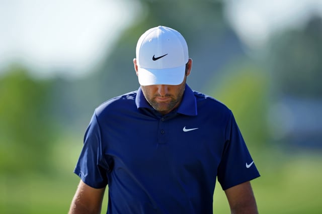 May 18, 2025; Charlotte, North Carolina, USA; Scottie Scheffler walks off the 14th green during the final round of the PGA Championship golf tournament at Quail Hollow.