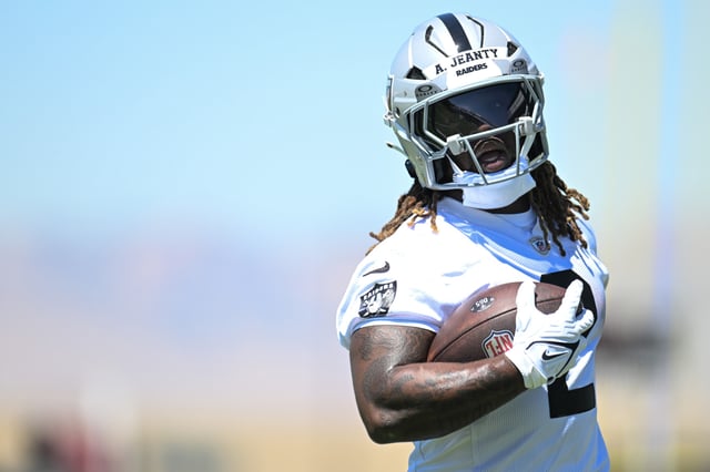 Ashton Jeanty #2 of the Las Vegas Raiders holds the ball during a drill at rookie minicamp at Intermountain Health Performance Center on May 09, 2025 in Henderson, Nevada.