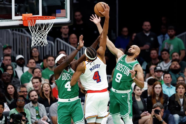 FILE: Boston Celtics guards Jrue Holiday and Derrick White defend against Golden State Warriors guard Moses Moody in the first quarter at TD Garden.