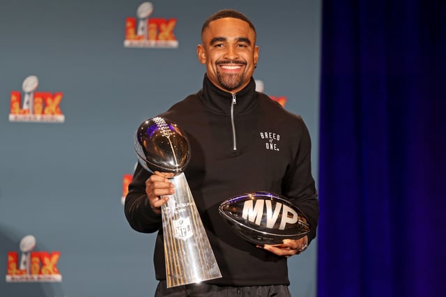 Quarterback Jalen Hurts #1 of the Philadelphia Eagles, the MVP of Super Bowl LIX, holds both the MVP and Vince Lombardi trophies during a press conference at the Ernest N. Morial Convention Center on February 10, 2025.