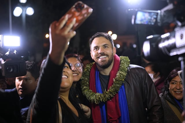Eduardo Del Castillo poses for a group selfie with a supporters after he was announced as the presidential candidate for the official Movement Towards Socialism, MAS, political party, in La Paz, Bolivia, Friday, May 16, 2025. (AP Photo/Juan Karita)