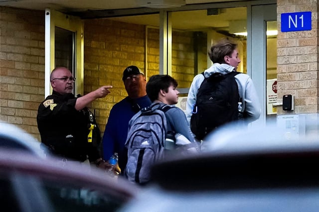 Law enforcement directs students outside of Wilgus Hall following an emergency incident at the University of Wisconsin-Platteville on May 19, 2025 in Platteville, Wisconsin.