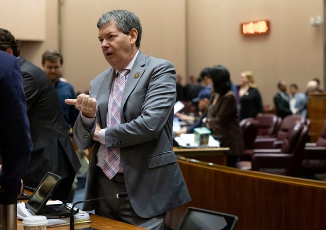 Ald. Brian Hopkins, 2nd, talks to colleagues before a City Council meeting, April 16, 2025, at City Hall. (Brian Cassella/Chicago Tribune)