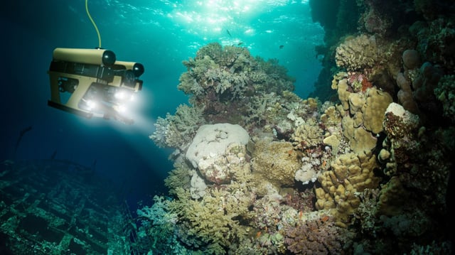 Robot inspects a sunken ship deep under water