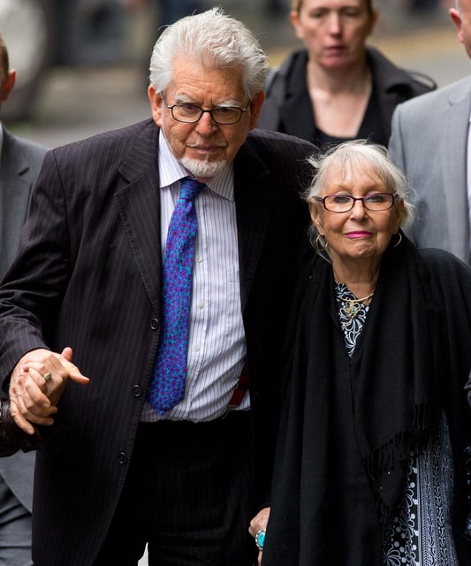 Rolf Harris arrives at Southwark Crown Court with his wife Alwen Hughes in 2014.