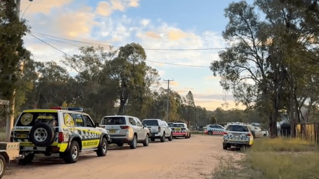 police and emergency services at along a dirt road close to where two boys where found dead at a property at Coonabarabran. (Source: ABC News / AAP)