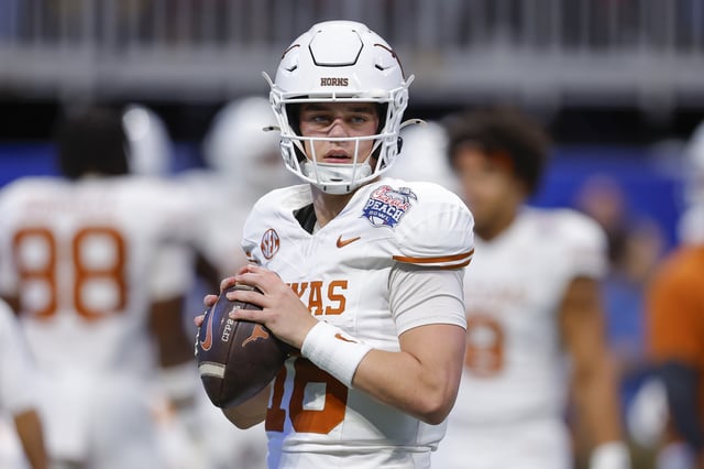 Arch Manning #16 of the Texas Longhorns warms up prior to the Chick-fil-A Peach Bowl between the Texas Longhorns and Arizona State Sun Devils at Mercedes-Benz Stadium on January 1, 2025 in Atlanta, Georgia.