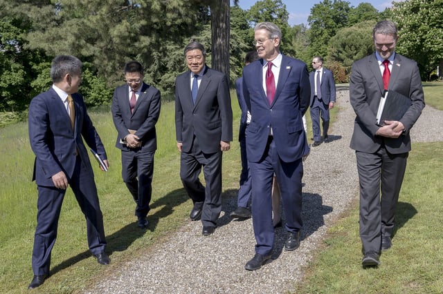 U.S. Secretary of the Treasury Scott Bessent, center right, U.S. Trade Representative Jamieson Greer, right, Chinese Vice Premier He Lifeng, center right, and Chinese ambassador to the World Trade Organization Li Chenggang, speak during a bilateral meeting between the United States and China, in Geneva, Switzerland, on Saturday, May 10, 2025. (Martial Trezzini/Keystone via AP)