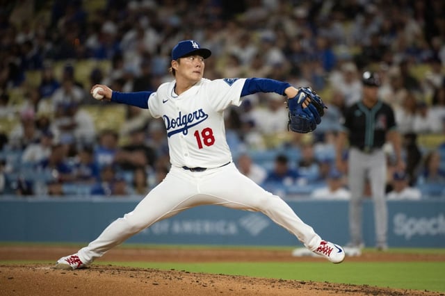 Dodgers starting pitcher Yoshinobu Yamamoto delivers a pitch during the sixth inning of a baseball game against the Arizona Diamondbacks in Los Angeles, Tuesday, May 20, 2025. (AP Photo/Kyusung Gong)