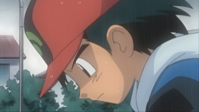 A screenshot featuring Ash in the rain in the Pokemon anime.