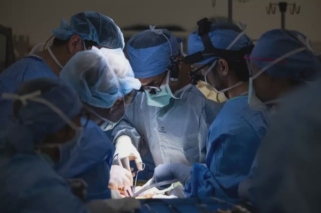 Bladder transplant—surgeons in the operating room with spotlight on patient's torso Nick Carranza/UCLA Health