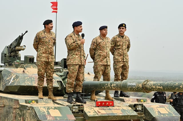 Chief of Army Staff of Pakistan Asim Munir holds a microphone during his visit at the Tilla Field Firing Ranges (TFFR) to witness the Exercise Hammer Strike, a high-intensity field training exercise conducted by the Pakistan Army's Mangla Strike Corps, in Mangla, Pakistan May 1, 2025. Inter-Services Public Relations (ISPR)/Handout via REUTERS/File Photo