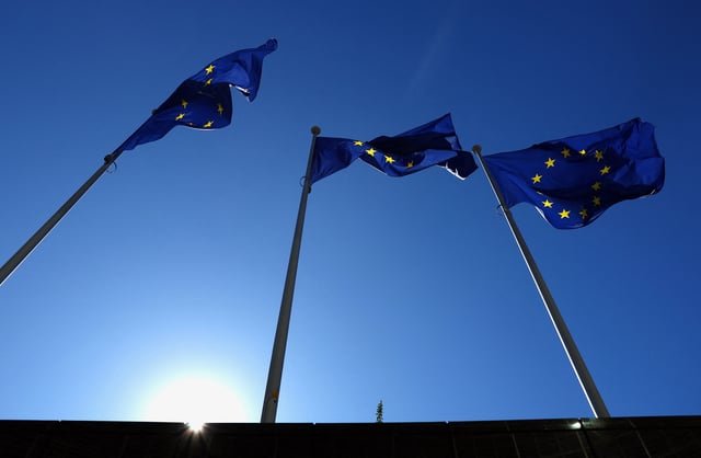 European Union flags flutter outside the EU Commission headquarters in Brussels, Belgium March 18, 2025. REUTERS/Yves Herman/File Photo