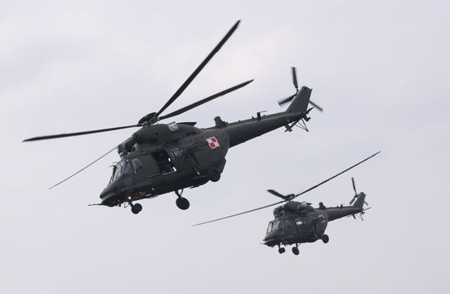 PZL W-3 Sokol helicopters of the Polish armed forces fly over the Vistula River during the NATO Dragon 24 military exercise on March 04, 2024 near Gniew, Poland.