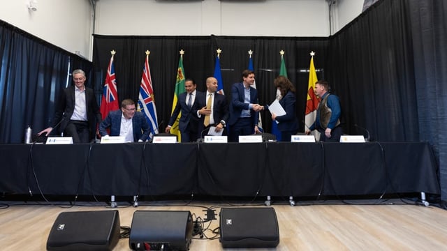 Northwest Territories Premier R.J Simpson, from left, Saskatchewan Premier Scott Moe, Manitoba Premier Wab Kinew, Yukon Premier Ranj Pillai, British Columbia Premier David Eby, Alberta Premier Danielle Smith and Nunavut Premier P.J. Akeeagok chat at the conclusion of a media availability at the 2024 Western Premiers’ Conference in Whitehorse in June 2024. The premiers will meet again on Wednesday and Thursday in Yellowknife. 