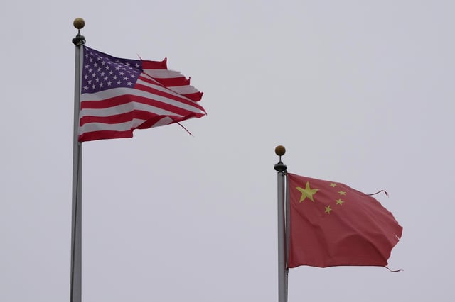 A flag of the United States flies next to a flag of China in Chinatown in San Francisco on April 18, 2025.