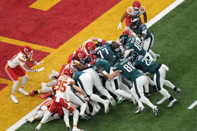 Feb 9, 2025; New Orleans, LA, USA; Philadelphia Eagles quarterback Jalen Hurts (1) rushes the ball for a touchdown against the Kansas City Chiefs during the first quarter in Super Bowl LIX at Caesars Superdome. Mandatory Credit: Kirby Lee-Imagn Images/File Photo