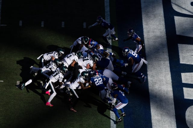 EAST RUTHERFORD, NEW JERSEY - OCTOBER 20: Jalen Hurts #1 of the Philadelphia Eagles scores a touchdown with the Tush Push play against the New York Giants during their game at MetLife Stadium on October 20, 2024 in East Rutherford, New Jersey. (Photo by Al Bello/Getty Images)