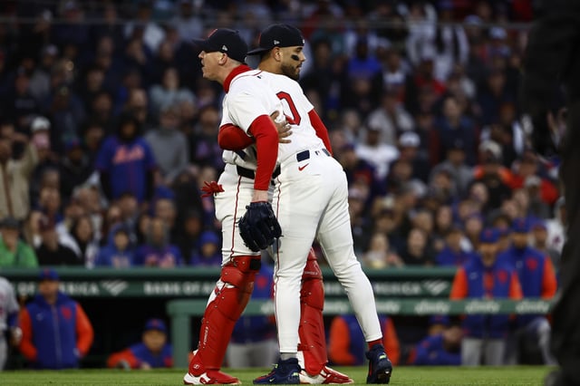 BOSTON, MA - MAY 20: Pitcher Walker Buehler #0 of the Boston Red Sox shouts at home plate umpire Mike Estabrook after a pitch he thought was a strike was called a ball, as Carlos Narváez #75 holds him back during the second inning against the New York Mets at Fenway Park on May 20, 2025 in Boston, Massachusetts. Buehler was thrown out of the game by Estabrook.