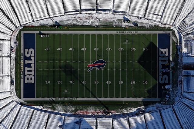 Jan 15, 2024; Orchard Park, New York, USA; A general overall view of the Buffalo Bills logo at midfield of a snow-covered Highmark Stadium during a 2024 AFC wild card game between the Pittsburgh Steelers and the Buffalo Bills. Mandatory Credit: Kirby Lee-USA TODAY Sports
