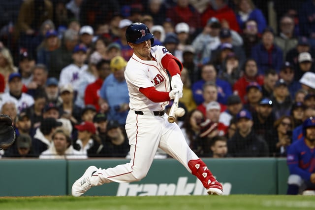 BOSTON, MA - MAY 19: Alex Bregman #2 of the Boston Red Sox doubles in the third inning against the New York Mets at Fenway Park on May 19, 2025 in Boston, Massachusetts.