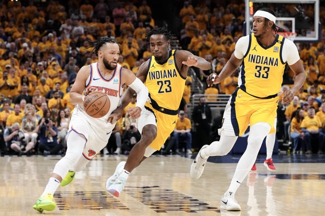 INDIANAPOLIS, INDIANA - MAY 17: Jalen Brunson #11 of the New York Knicks drives to the basket against Aaron Nesmith #23 and Myles Turner #33 of the Indiana Pacers during the first quarter in Game Six of the Eastern Conference Second Round Playoffs at Gainbridge Fieldhouse on May 17, 2024 in Indianapolis, Indiana.