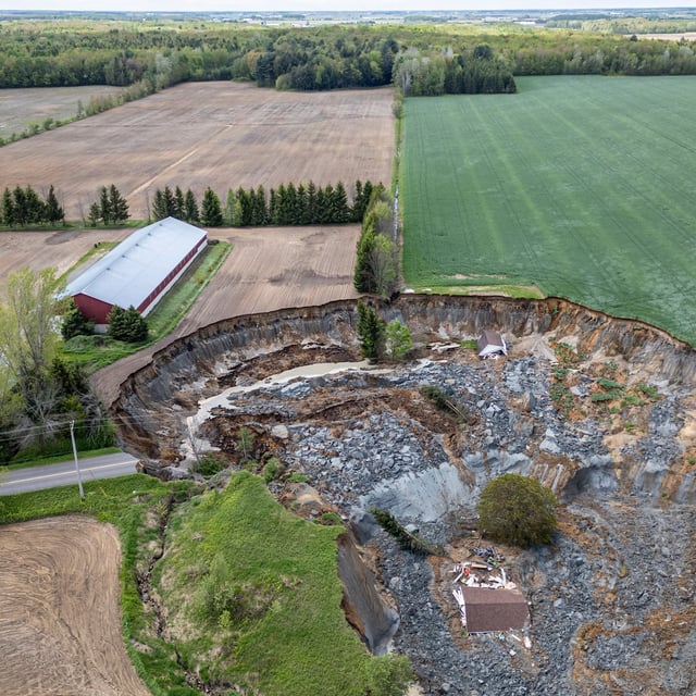 A home is seen after being swept away by a major landslide in Ste-Monique, Que., northeast of Montreal, on Wednesday, May 21, 2025. THE CANADIAN PRESS/Christinne Muschi