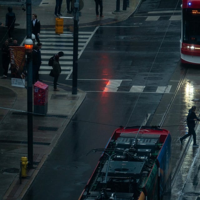 Pedestrians cross the street in Toronto, Wednesday, May 21, 2025. THE CANADIAN PRESS/Giordano Ciampini