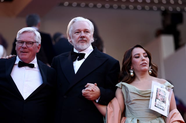 WikiLeaks founder Julian Assange, his wife Stella Assange, and the team of the documentary film "The Six Billion Dollar Man" presented as part of Special Screenings, pose on the red carpet during arrivals for the screening of the film "The History of Sound" in competition at the 78th Cannes Film Festival in Cannes, France, May 21, 2025. REUTERS/Sarah Meyssonnier