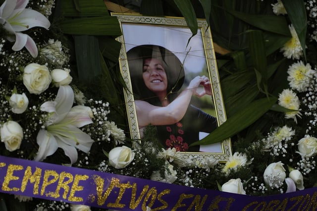 A framed image of Ximena Guzmán, the personal secretary to Mexico City Mayor Clara Brugada who was murdered a day earlier, adorns an altar during a wake at a funeral home in Mexico City, Wednesday, May 21, 2025. (AP Photo/Marco Ugarte)