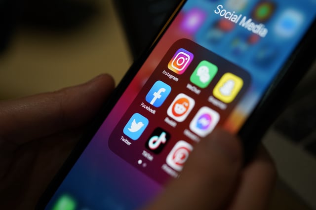 Social media applications seen on the a smartphone screen.