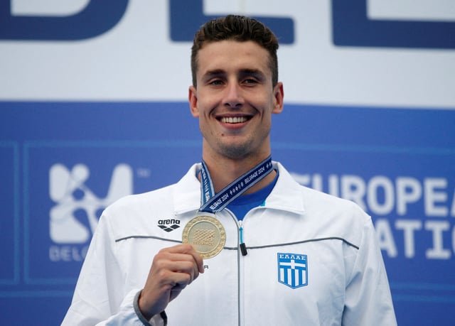 Swimming - European Aquatics Championships - Sports and Recreational Center Milan Gale Muskatirovic, Belgrade, Serbia - June 23, 2024 Gold medallist, Greece's Kristian Gkolomeev poses with his medal on the podium after winning the men's 50m freestyle final REUTERS/Novak Djurovic/File Photo
