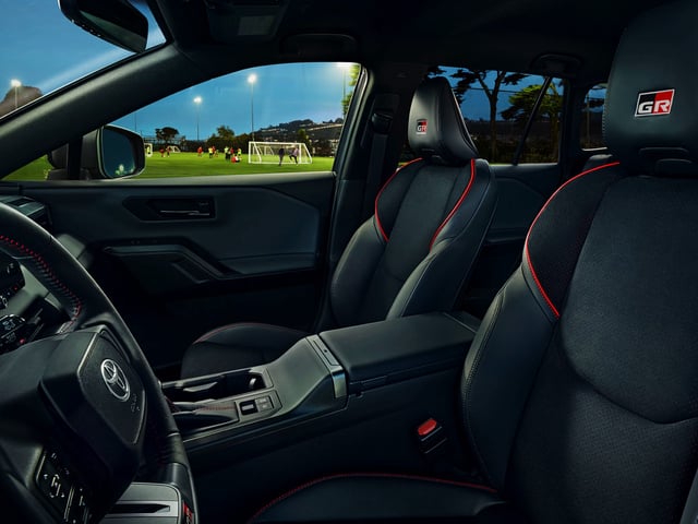 The interior of a 2026 Toyota RAV4 GR Sport plug-in hybrid SUV.