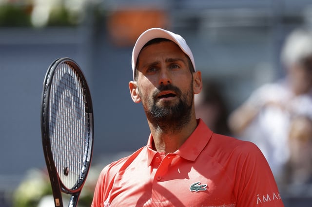 Tennis - Madrid Open - Park Manzanares, Madrid, Spain - April 26, 2025 Serbia's Novak Djokovic reacts during his round of 64 match against Italy's Matteo Arnaldi REUTERS/Juan Medina/File Photo