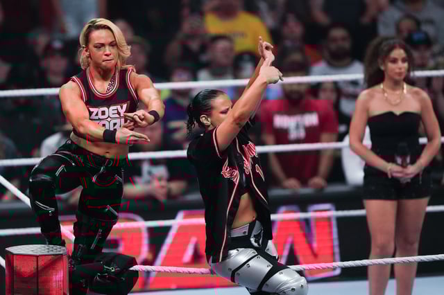 HOUSTON, TEXAS - MARCH 11: Zoey Stark (L) and Shayna Baszler (R) are introduced during WWE Monday Night RAW at Toyota Center on March 11, 2024 in Houston, Texas.