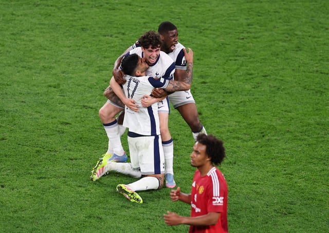 Soccer Football - Europa League - Final - Tottenham Hotspur v Manchester United - San Mames, Bilbao, Spain - May 21, 2025   Tottenham Hotspur's Kevin Danso, Cristian Romero and Archie Gray celebrate winning the Europa League as Manchester United's Joshua Zirkzee looks dejected REUTERS/Juan Medina     TPX IMAGES OF THE DAY