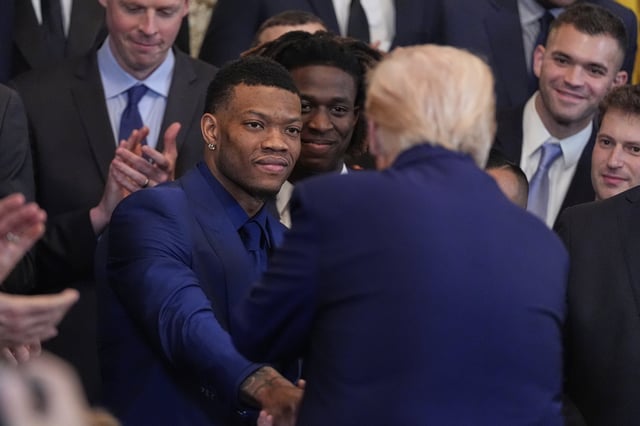 President Donald Trump shakes hands with Alijah Martin as he hosts the 2025 NCAA Champion, University of Florida men's basketball team in the East Room of the White House, Wednesday, May 21, 2025, in Washington. (AP Photo/Julia Demaree Nikhinson)
