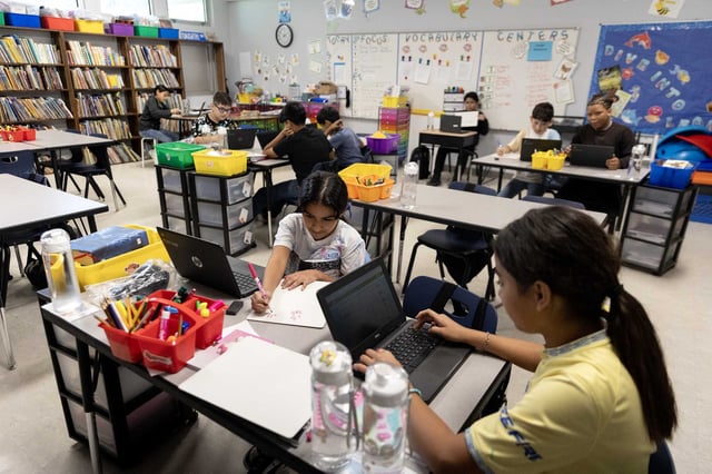 Waelder 5th grade students work on their math lesson in class.