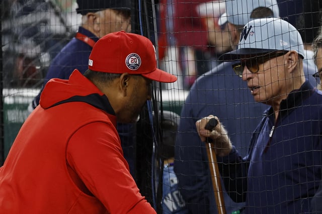 May 20, 2025; Washington, District of Columbia, USA; Washington Nationals manager Dave Martinez (4) talks with Nationals' principle owner Mark Lerner (R) after the Nationals' game against the Atlanta Braves at Nationals Park. Mandatory Credit: Geoff Burke-Imagn Images