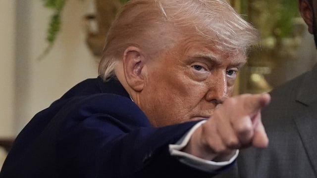 President Donald Trump gestures as he departs after hosting the 2025 NCAA Champion, University of Florida men's basketball team 