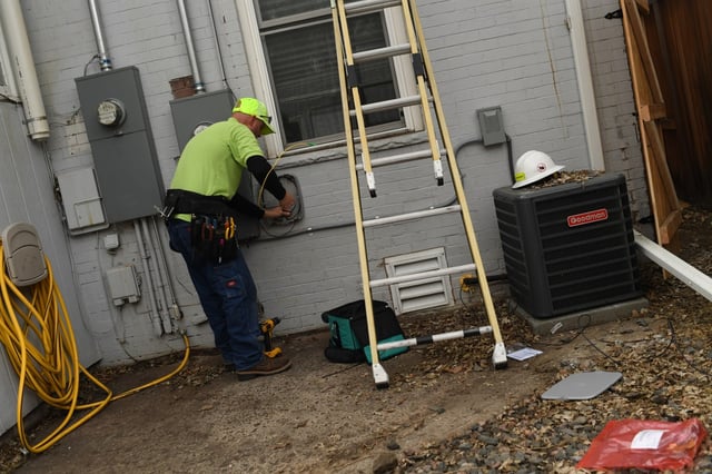 Steve Smith, of CenturyLink, works on a residential fiber install at a home in Highlands neighborhood on December 23, 2019 in Denver, Colorado. CenturyLink&#39;s fiber network, along with the related company Quantum Fiber, are being purchased by AT&amp;T for $5.75 billion. (Photo by RJ Sangosti/The Denver Post)