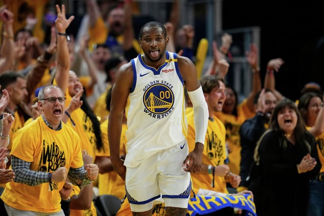 Golden State Warriors forward Jonathan Kuminga reacts after making a 3-point basket against the Minnesota Timberwolves on May 10, 2025, in San Francisco.