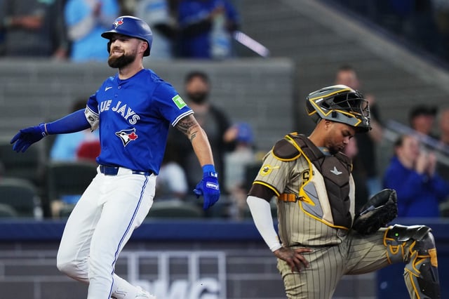 Toronto Blue Jays' Nathan Lukes (left) celebrates his two-run home run as San Diego Padres catcher Martin Maldonado (15) reacts during fifth inning MLB baseball action in Toronto on Wednesday, May 21, 2025. THE CANADIAN PRESS/Nathan Denette