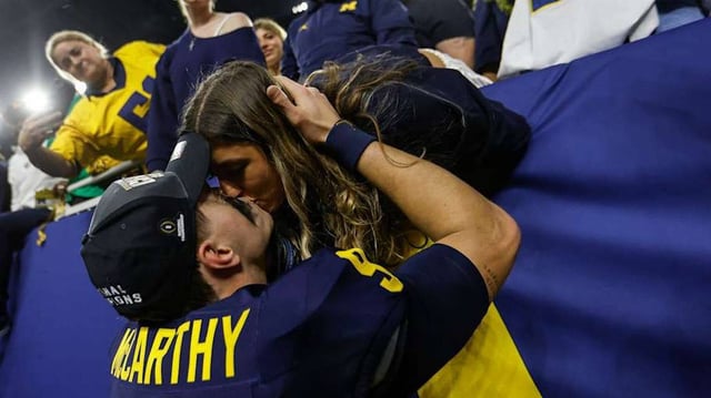 McCarthy kisses his fiance Katya Kuropas.