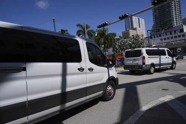 Department of Homeland Security vans leave carrying people detained by U.S. Immigration and Customs Enforcement agents at the Miami Immigration Court in Miami, on Wednesday, May 21, 2025. (AP Photo/Rebecca Blackwell)