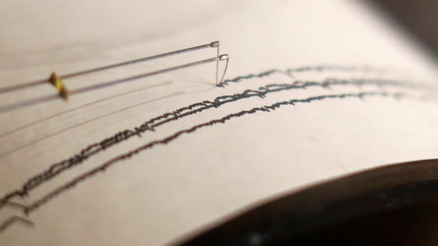 A working seismograph is shown in a display about earthquakes. 